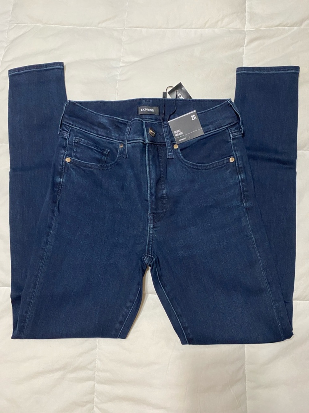 Express Skinny Mid Rise Jeans in Dark Wash Blue